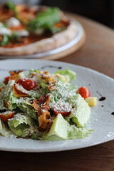 caesar salad appetizer on wooden background