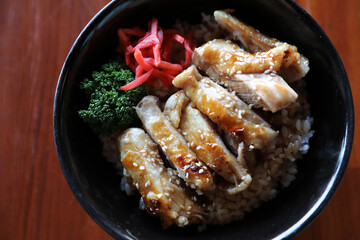 japanese food Chicken teriyaki with rice on wood background