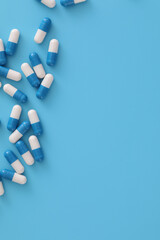 pills capsules isolated on blue background