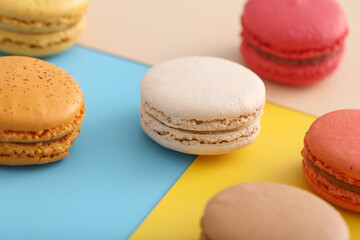 Colorful macarons isolated in pastel background