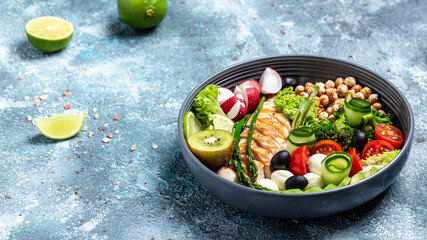 Buddha bowl with avocado, asparagus, chickpeas, broccoli, radish, chicken, cucumber, tomatoes, olives, mozzarella, cheese, fillet, fresh, salad, banner, menu, recipe. Healthy food
