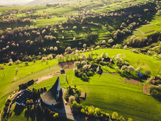 Spring landscape in Slovakia. Polana region, Hrinova. Green spring rural hills landscape, fields, flowering trees, organic farming © Zedspider