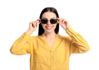 Beautiful young woman wearing stylish sunglasses on white background