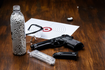 pistol replica, shield, glasses, speedloader and plastic balls