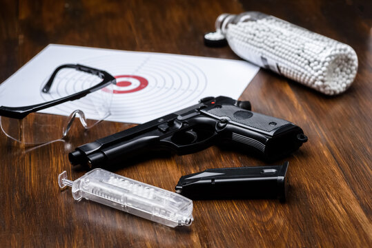 pistol replica, shield, glasses, speedloader and plastic balls