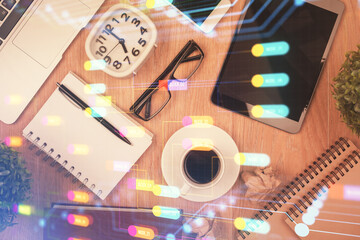 Double exposure of technology theme drawing over work table desktop. Top view. Global data analysis concept.