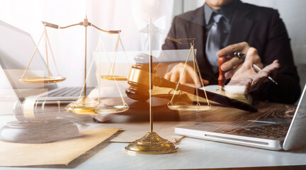 Business and lawyers discussing contract papers with brass scale on desk in office. Law, legal services, advice, justice and law concept picture with film grain effect