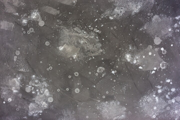 Gray wall with spots of paint. Decorative background.