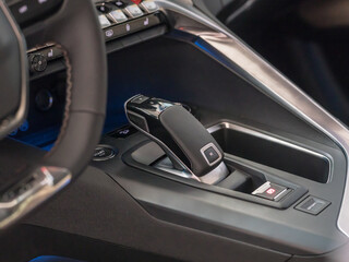 Obraz na płótnie Canvas Close-up photo of the electronic gear knob in the car cockpit