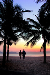 silhouette of a couple on the beach