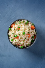 Vegan rice, overhead shot on a blue background