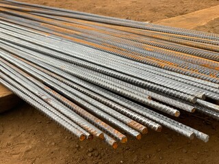 Steel construction reinforcement with longitudinal ribs and transverse protrusions.