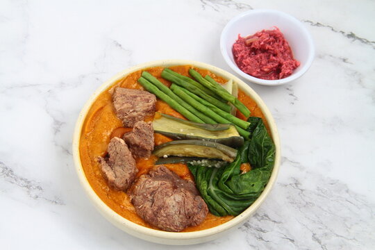 Filipino food called Kare Kare or meat and vegetables cooked in savory thick peanut sauce