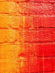 Red and orange painted brick wall with great texture for photoshop projects and backgrounds