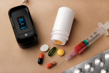 Health care: blood oxygen measurement pulse oximeter and blood sugar measurement glucometer. Devices for monitoring health during an epidemic. Medicine on background.