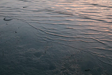 Calm sea wave under amazing sunset. Inspirational nature landscape, beautiful colors, wonderful scenery of tropical beach. Beach sunset, summer vacation