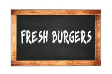Obraz premium FRESH BURGERS text written on wooden frame school blackboard.