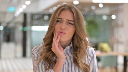 Portrait of Sad Businesswoman having Toothache