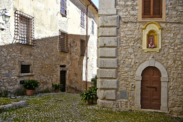Fototapeta na wymiar Sonnino, Italy, 05/10 / 2021. A street between old medieval stone buildings of a historic town in Lazio region, Italy.