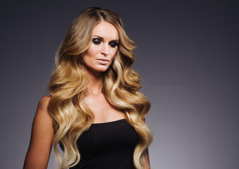 Fototapeta premium Beautiful woman withblonde hairstyle beauty over dark background