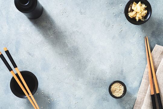 blue empty food background with sushi and asian food theme and concept. Chopstick