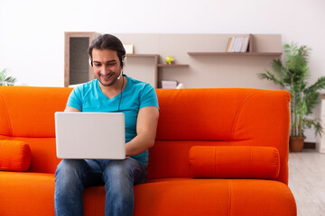 Young male student in tele-studying concept during pandemic