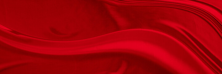 Black red satin dark fabric texture luxurious shiny that is abstract silk cloth background with patterns soft waves blur beautiful.