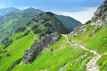 The ridgeway which leads from mount Kasprowy wierch along the polish-slovakian border. Some hikers...