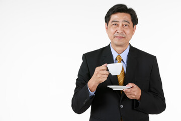 Senior asian businessman take coffee time after his business successfully. After this he might think about retirement and hands on all to next generation.