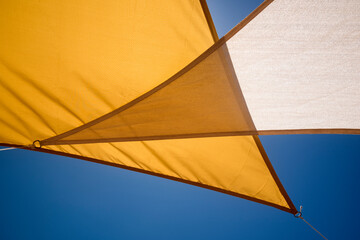 parasol awnings on the outdoor terrace under the blue sky