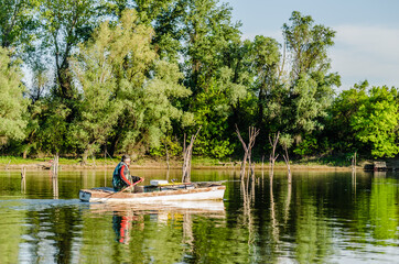 Fototapeta na wymiar Novi Sad, Serbia - May 05. 2021: Recreational, traditional, sports, fishing on a sunny day, on the waters of the Danube tributary near Novi Sad, Serbia. 