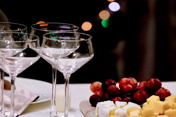 glasses of champagne on a table in a black background