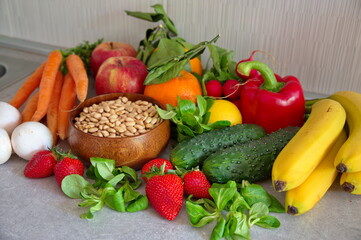 Healthy fruits and vegetables on kitchen desk