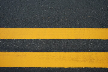 Fototapeta premium Yellow traffic line Used to divide the traffic direction.
