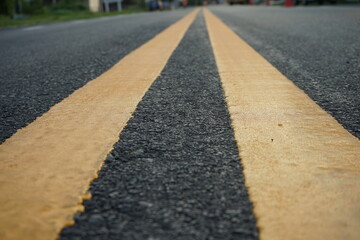 Obraz premium Yellow traffic line Used to divide the traffic direction.