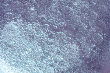 Abstract background with oil droplets on water surface blue