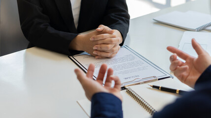 Employers read the resume of applicants at the interview room. The concept of hiring
