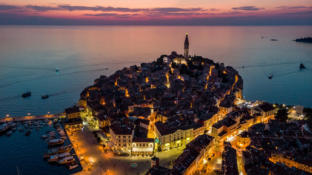 Fototapeta Aerial view of Istrian Town Rovinj, Croatia just after the sunset.  Church of St. Euphemia in the backhround.
