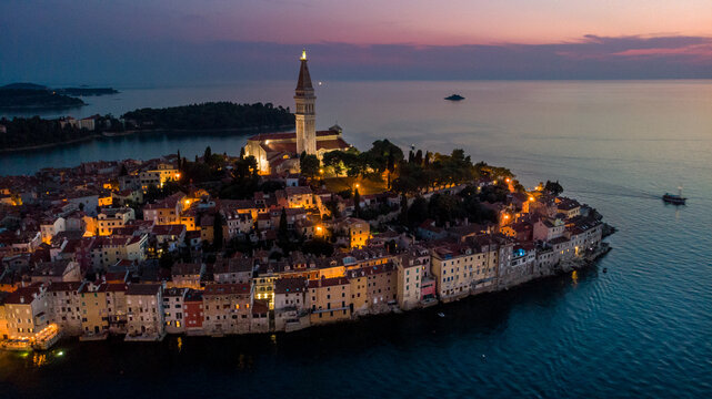Fototapeta Aerial view of Istrian Town Rovinj, Croatia just after the sunset. Church of St. Euphemia in the backhround.