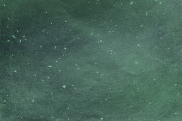 Rough textured paper dyed to gradient green. Washi paper texture background