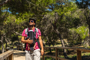 A young father on the path to Playa Moncayo on the Mediterranean Sea in Guardamar del Segura next to Torrevieja, Alicante. Community of Valencia. Spain