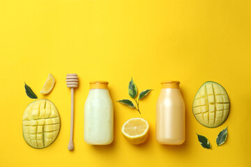 Natural mango shower gel and ingredients on yellow background