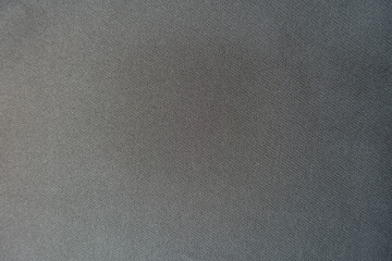 Texture of simple dark gray viscose and polyester fabric from above