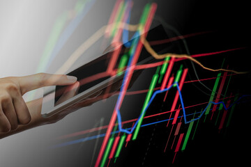 A stock graph over the dark background. 