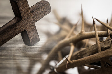 A wooden cross with thorn crown.