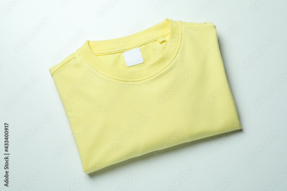 Canvas Prints Yellow sweatshirt on white background, space for text