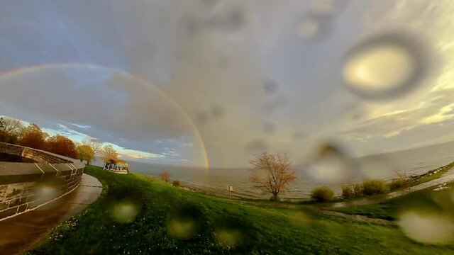 Timelapse of a Perfect Rainbow with a double rainbow spring season
