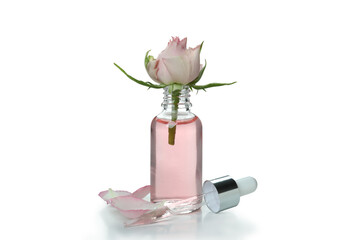 Rose essential oil isolated on white background