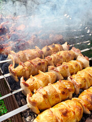 Young potatoes are wrapped in bacon and baked on the grill