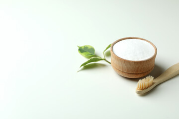 Eco friendly toothbrush and tooth powder on white background